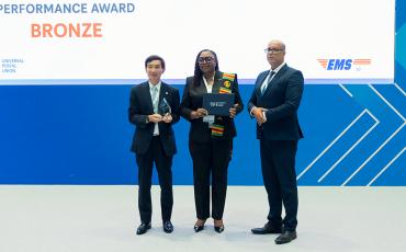 EMS Ghana receiving their Bronze performance award